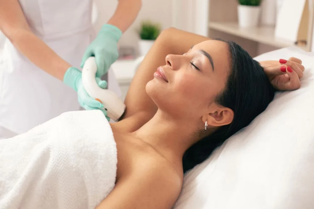Patient receives comfortable underarm laser hair removal treatment from a medical professional in Powell, WY.