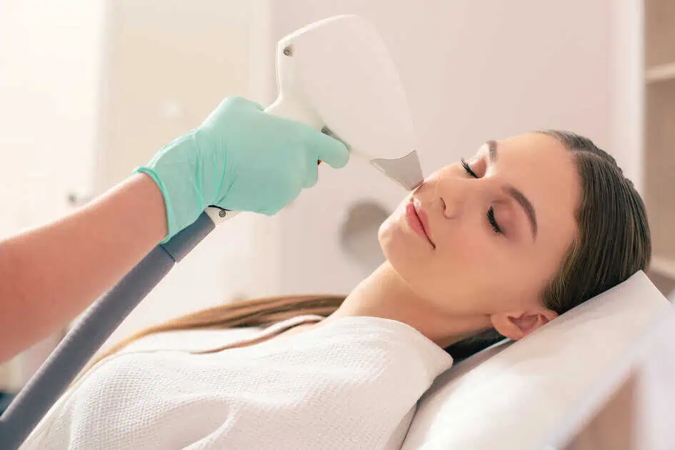 Patient receives facial laser hair removal with Alma Soprano device in a clinic, Powell, WY.