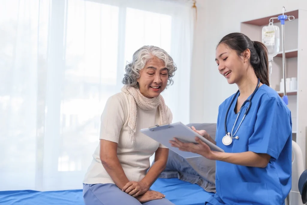 Healthcare provider reviewing advanced wellness testing results with an older patient at Northern Wyoming Wellness + Aesthetics in Powell, Wyoming